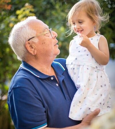 Man holding young girl