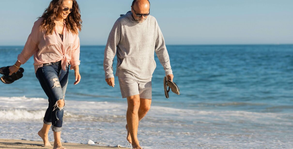 Couples walking on the beach