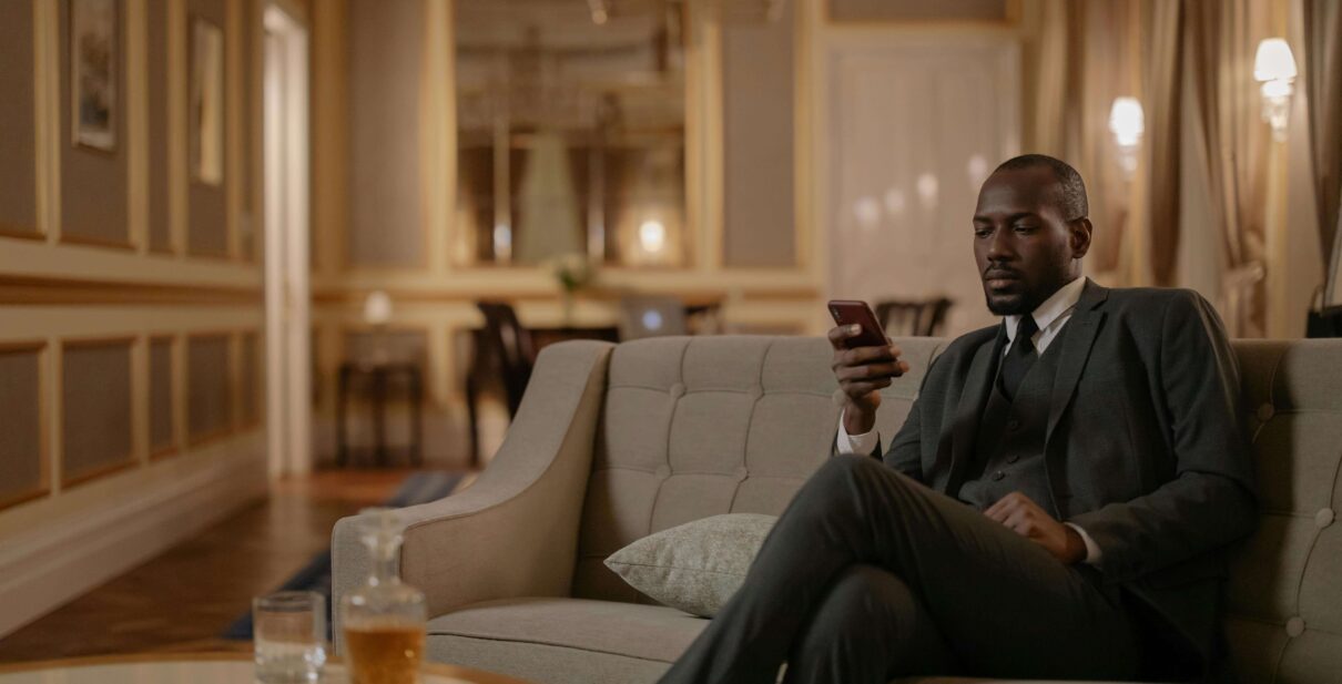 Wealthy man sitting on the couch